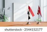 FLAGS OF IRAQ AND NEPAL ON TABLE