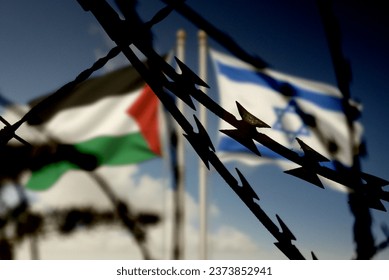 Flags of Israel and Palestine and barbed wire - Shutterstock ID 2373852941