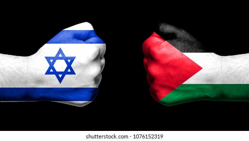 Flags Of Israel And Palestine Painted On Two Clenched Fists Facing Each Other On Black Background/Israel - Palestinian Conflict Concept