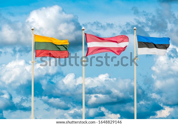 Flags of the Lithuania,\
Latvia and Estonia. Flags of the Baltic States waving on the sky\
background