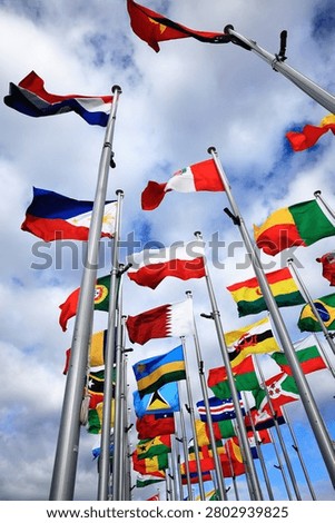 Flags of many countries gathering for global finance, security, and international cooperation, vertical