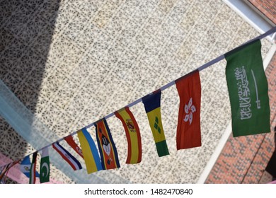 Flags of many countries, put together on a string in an international conference