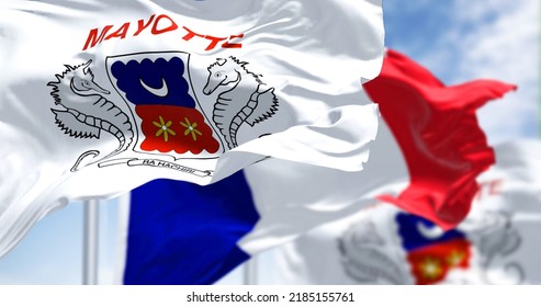 Flags Of Mayotte Waving In The Wind With National Flag Of France On A Clear Day. Mayotte Is An Overseas Department And Region And Single Territorial Collectivity Of France