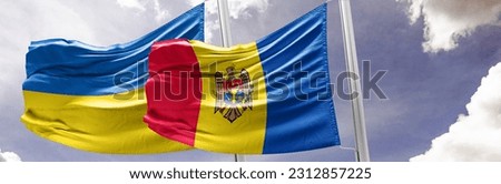 Flags of moldova and ukraine on flagpoles 