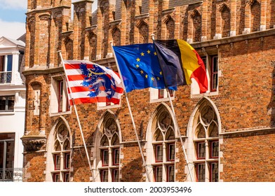 Flags on building in Bruges, West Flanders, Belgium.