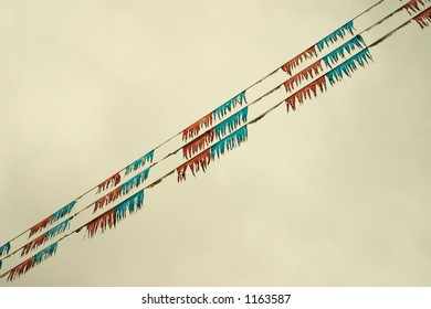 Flags On A Used Car Lot In A Diaganol Direction Across The Image