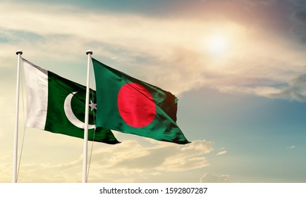 Flags of Pakistan and Bangladesh friendship flag waving on the sky with beautiful sun light - image - Shutterstock ID 1592807287