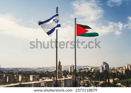 flags of Palestine and Israel against sky and old Jerusalem. Two States for two peoples. Two-state solution concept. Separate ownership of Jerusalem. The division of the city between two peoples.