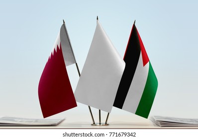 Flags Of Qatar And Palestine With A White Flag In The Middle