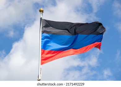 Flags Of Russia, Donetsk People's Republic. The Donetsk And People's Republics Are Partially Recognized State Entities In Eastern Europe. Flag On Blue Sky Background