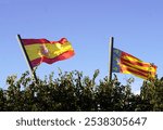 flags of spain and valencian community waving together in the wind. trajedia en valencia inundacion, dana, crisis