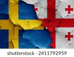flags of Sweden and Georgia painted on cracked wall