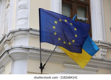 Flags of Ukraine and European Union on building facade - Shutterstock ID 2182684141
