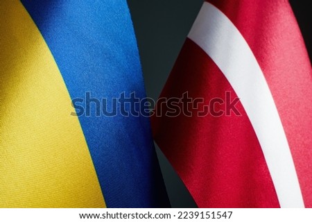 Flags of Ukraine and Latvia as symbol of cooperation.