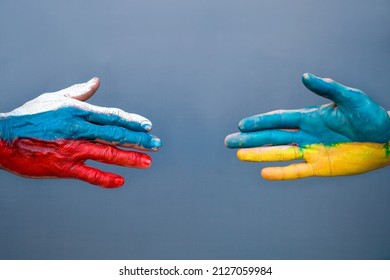 Flags of Ukraine and Russia The flag on the hands move away from each other. Conflict Ukraine vs Russia in World War Crisis Concept - Powered by Shutterstock