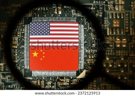 Flags of USA and China  on a processor. Computer board with chip. View through magnifying glass. Artificial intelligence or AI. Trade, tariffs, duty and customs war