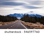 Flagstaff Arizona with lenticular clouds over the snow covered San Francisco Peak. Scenic road trip during the winter, USA.