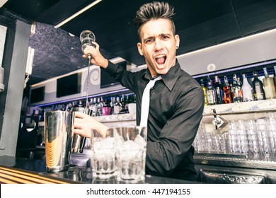 Flair Bartender At Work In A Night Club - Barman Mixing Some Cocktail In A Bar