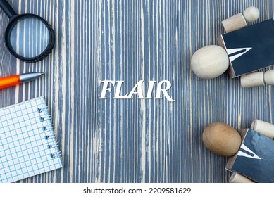 FLAIR - Word (text) On A Wooden Background, Notepad And Pen With Calculator. Business Concept (copy Space).