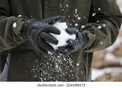 Flakes flying off of a snowball