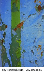 Flaking paint of the blue metalic wall