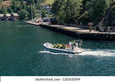 Flam, Norway - July 2018: Tourists On A Aurlandsfjord Fjord Safari Tour In The Flam Harbor On A RIB Boat