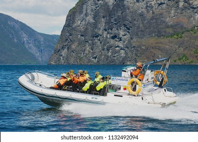 FLAM, NORWAY - JUNE 08,2012: Unidentified Tourists Enjoy The Safari Tour By Speed Boat At The Aurlandsfjord In Flam, Norway.