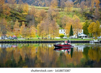 Flam / Norway - Oct 16 2019 : FjordSafari Flam Guide Service, A Speed Boat Takes Tourists Out To See The Beauty Of Fjord During The Autumn Season In Flåm, Norway.