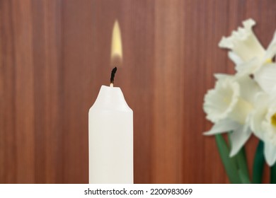 Flame Candle With Flower. A White Wax Candle With Flowers Burns In Honor Of The Memory.