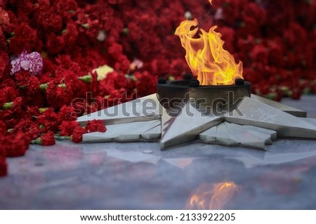 The flame of the eternal flame of the monument of the Second World War. A symbol of the solemn memory of the people about the fallen heroes. May 9, Victory Day. Selective focus