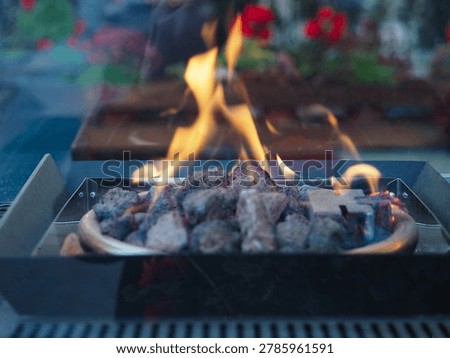 flame in fire pit with lave rocks