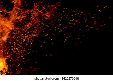 Flame Of Fire With Sparks On A Black Background