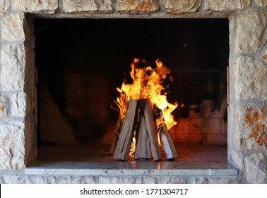 Flame in fireplace, log combustion, barbecue fire