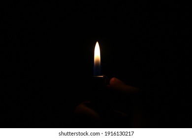 The Flame Of A Lighter In The Dark