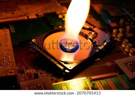 The flame is on the hard disk drive that lies on the printed circuit boards.