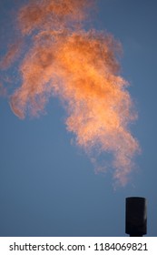 Flame Shoots High From A Gas Flare During A Welltest On A Gas Well In Western Australia. Occasional Slugs Of Liquid Burn With A Puff Of Black Soot While The Gas Burns With A Clean Flame.