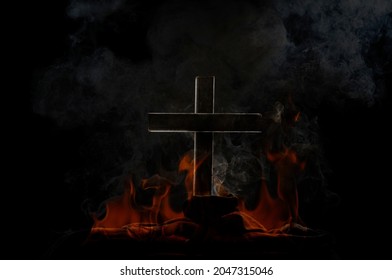 flame and smoke burning cross on a black and dark background