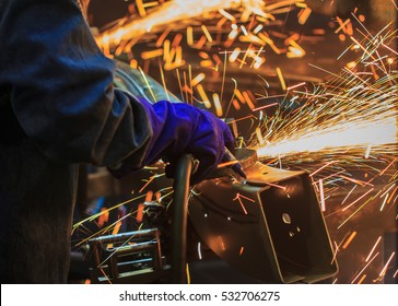 Flame sparks with electric grinder the swaying back and forth all the time - Shutterstock ID 532706275