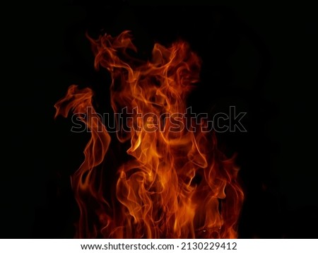 Flame Flame Texture For Strange Shape Fire Background Flame meat that is burned from the stove or from cooking. danger feeling abstract black background Suitable for banners or advertisements.