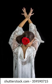 Flamenco Dancer Backs With White Dress And Hands Crossed Up On His Back On Black Background