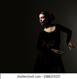 Flamenco Dancer On A Dark Background. Free Space For Your Text