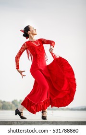 Flamenco Dancer Spain Womans In A Long Red Dress Dances On The Beach