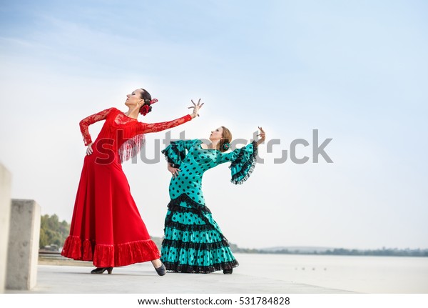 Flamenco\
dancers Spain woman in a long dress on the\
lake
