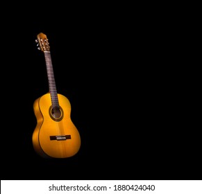 Flamenco Guitar On Black Background With Copy Space