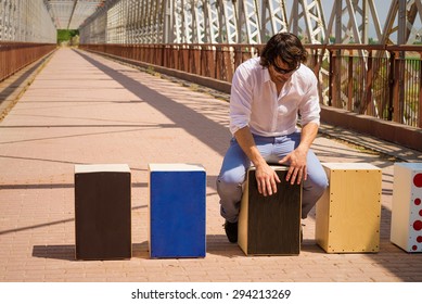 Flamenco musician with an assortment of cajon instruments