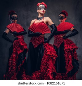 Flamenco Spanish Seductive Dancers Wearing Traditional Costume.