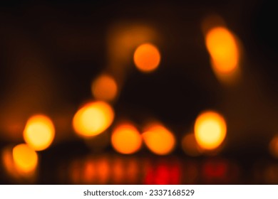 Flames in a fireplace, abstract blurred background photo with yellow lights, natural  bokeh effect - Powered by Shutterstock