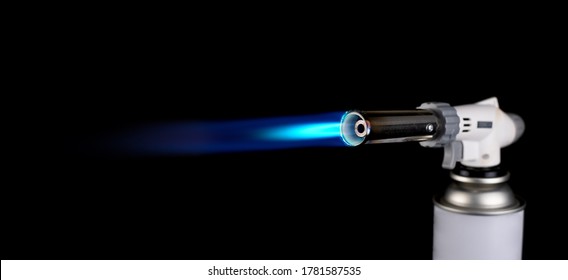 Flamethrower Burner Gas Blow Torch Ignition With Blue Fire Flame At Black Background