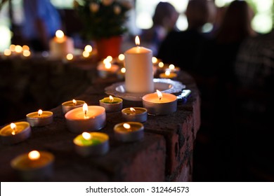 Flaming candles at the funeral ceremony indoor - Shutterstock ID 312464573