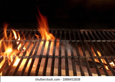 Flaming Empty BBQ Charcoal Grill, Closeup. Hot Barbeque Grill Ready Cooking Food On Cast Iron Grate. Concept For Cookout, Barbecue Party At Garden Or Backyard. Grill With Bright Flames Black Isolated.
